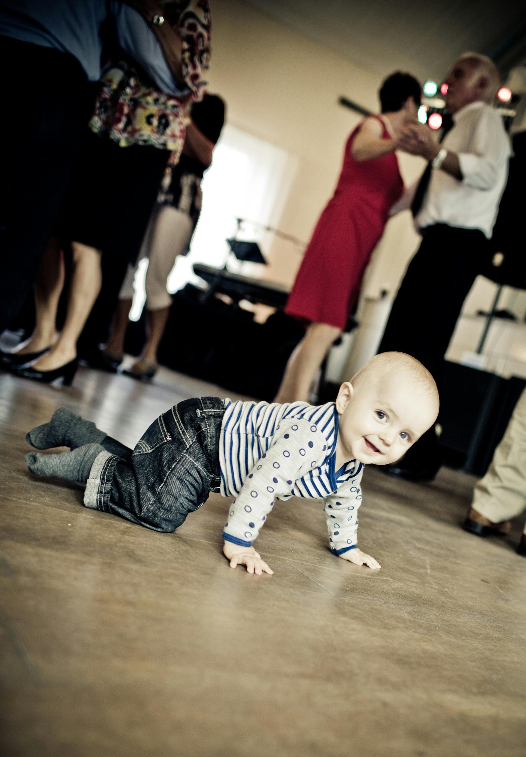 Happy toddler crawling on a soft play mat